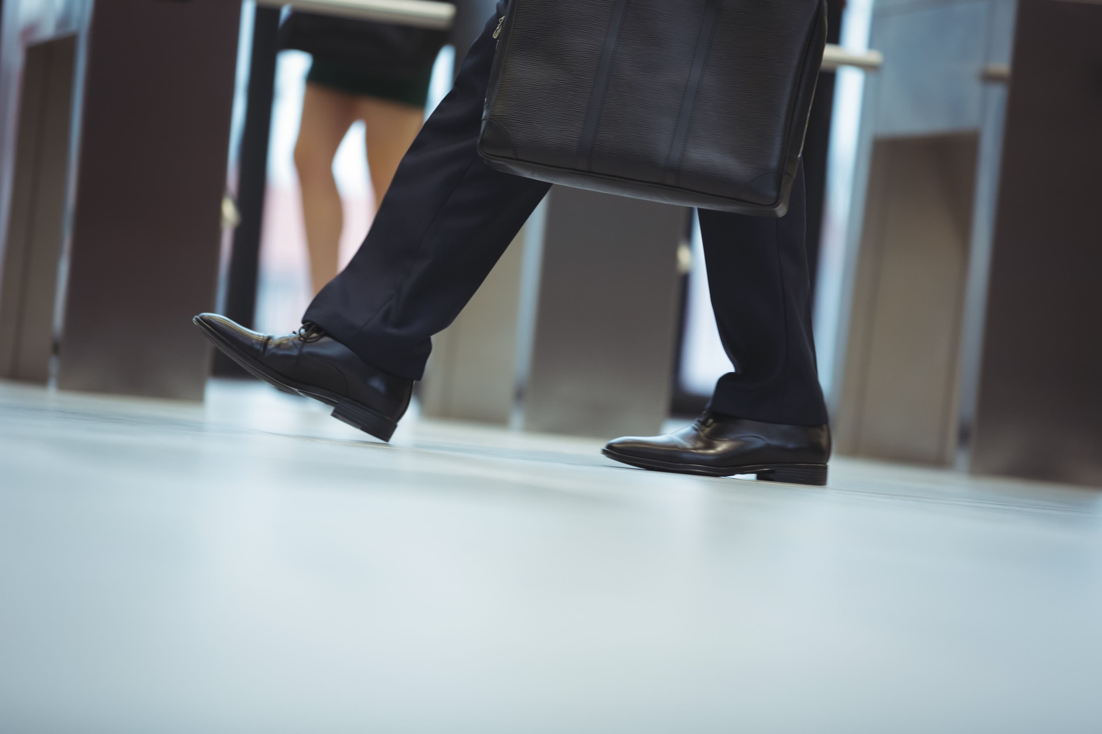 Businessman in formal shoes in Centurion office corridor